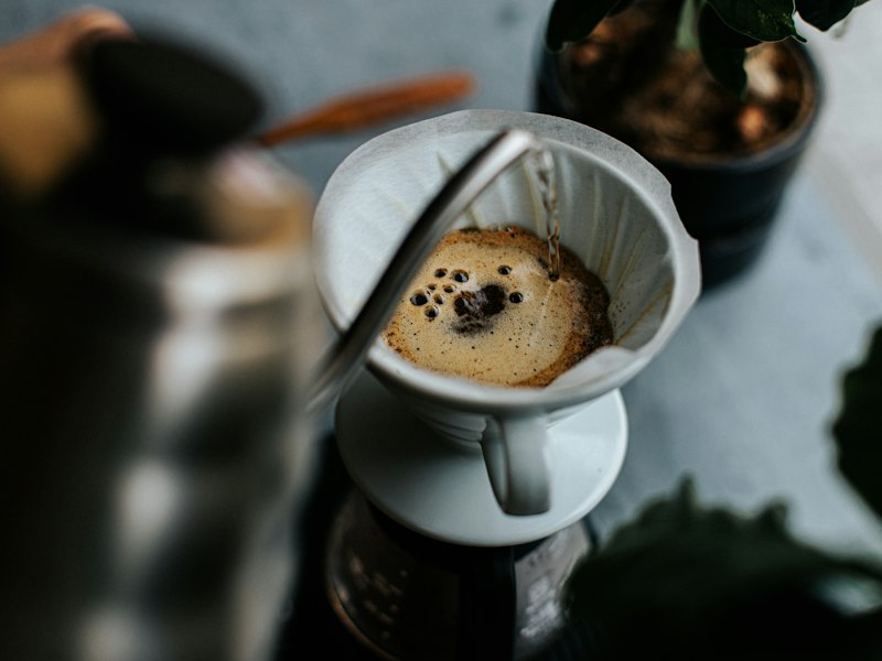 A cup of coffee with a dog on it