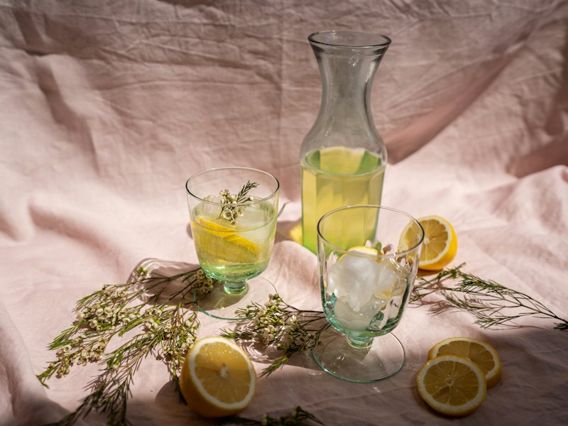 Clear glass pitcher with lemon juice